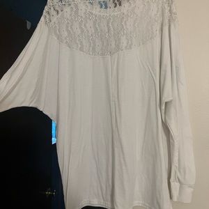 Sheer white Piko style top with lace detail on back of shoulders